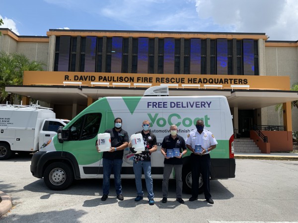 Automotive Art and YoCoat Team Members along with Miami-Dade Police and Fire handing over donated products.
